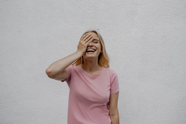 Laughing Attractive Blonde Woman Touching Face Grey Wall Street — Stock Photo, Image