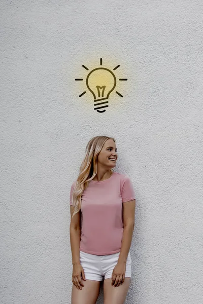 Smiling Attractive Blonde Woman Looking Away Street Light Bulb Sign — Stock Photo, Image