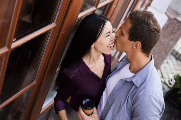 Awesome cool and attractive couple on romantic date, sit on roof