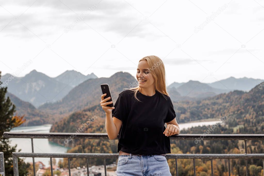 Internet 4g roaming abroad. Travel services online, mobile service package. Offline maps on smartphone. Voyage, journey, mountains tour, Alpine landscape background. People adventures, young tourist