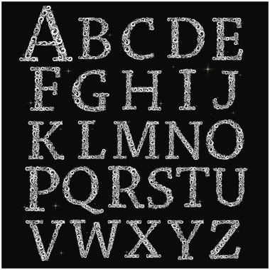 Siyah arkaplanda eski vektör harfleri kümesi.