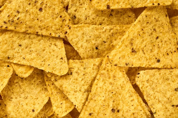El fondo de los nachos de maíz triangulares amarillos — Foto de Stock