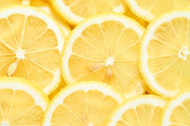 yığın taze sarı limon dilimleri arka plan. tasarımınız için desen