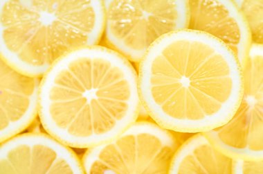 yığın taze sarı limon dilimleri arka plan. tasarımınız için desen