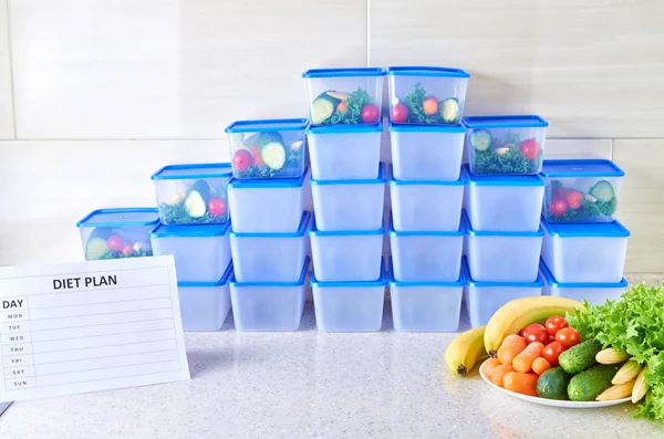 A meal plan for a week on a white table among set of plastic containers for food and food. Proper nutrition during the week.