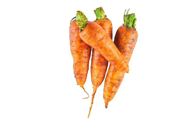 Cuatro zanahorias frescas aisladas sobre fondo blanco. La vista desde arriba. Fondo alimentario ecológico . —  Fotos de Stock