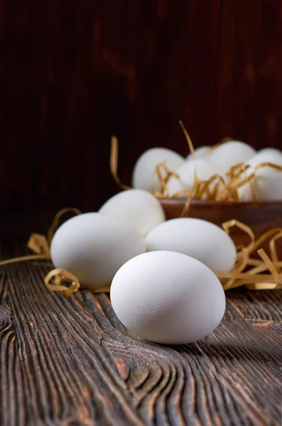 Fresh white eggs on the village table. Low key.