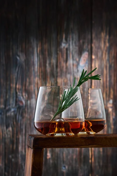 Two Crystal Glasses Shot Whiskey Sprig Rosemary Counter Old Wooden — Stock Photo, Image