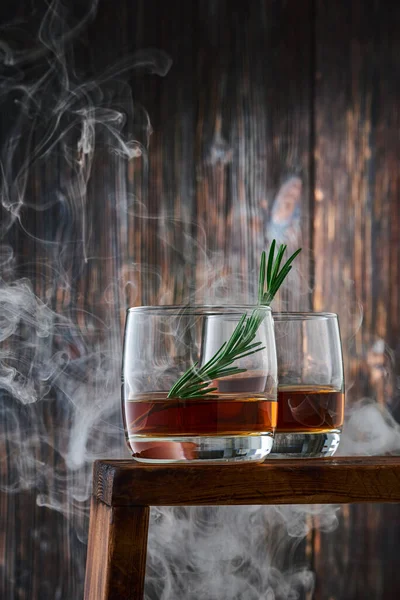Two Glasses Shot Whiskey Sprig Rosemary Counter Clouds Smoke Old — Stock Photo, Image