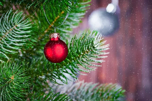 Christmas Background Spruce Branch Red Ball Branch Falling Snow New — Stock Photo, Image