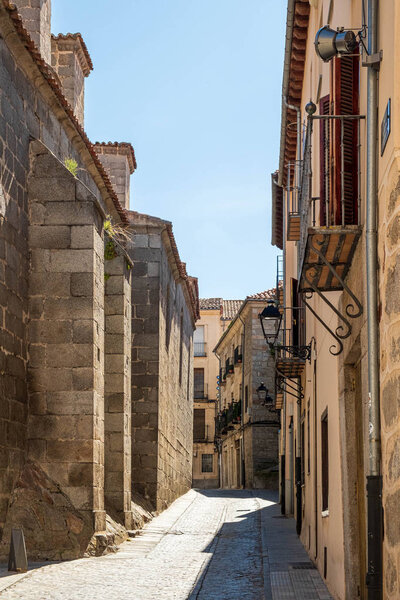 Detail view of street one side of church in Avila, Spain