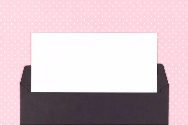 Black envelope with white card