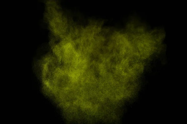 Light green powder explosion on black background. Colored powder cloud. Colorful dust explode. Paint  Holi.