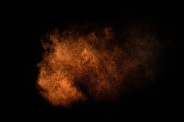 Oranje Poeder Explosie Zwarte Achtergrond Gekleurde Poeder Wolk Kleurrijke Stof — Stockfoto