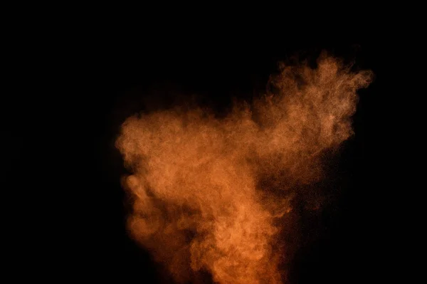 黒い背景にオレンジの粉塵爆発 色粉の雲 カラフルなダストが爆発します ペイント ホーリー — ストック写真