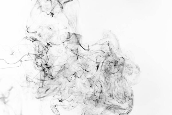 Freeze motion of black smoke isolated on white background. Abstract vape clouds.
