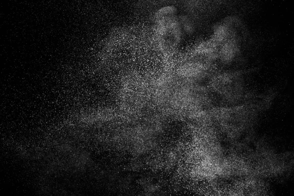 Freeze motion of white particles on black background. — Stock Photo, Image