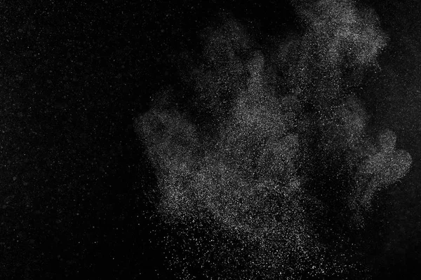 Παγώσει κίνηση μορίων λευκό σε μαύρο φόντο. — Φωτογραφία Αρχείου