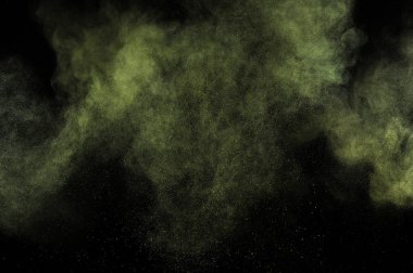 Siyah zemin üzerine altın tozu patlama. Sarı bulut. Altın toz patlayabilir. Hareket boya Holi dondur.
