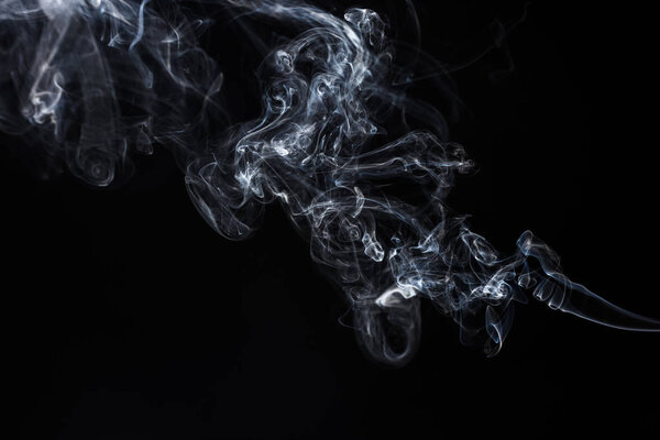 Smoke on black background. Abstract vape clouds. Freeze motion.