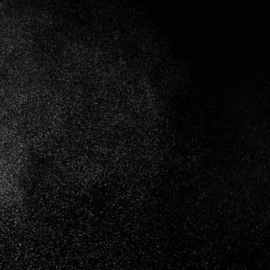 Kare siyah bir zemin üzerine su soyut sıçraması.