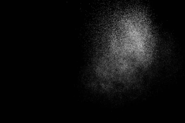 stock image Abstract splashes of water on black background. Freeze motion of white particles. Rain, snow overlay texture.