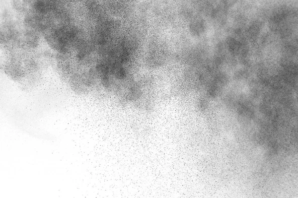 Black particles explosion isolated on white background.  Abstract dust overlay texture.