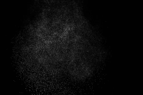 Siyah arkaplanda soyut su sıçramaları.