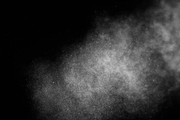 Gefrierbewegung weißer Partikel auf schwarzem Hintergrund. — Stockfoto