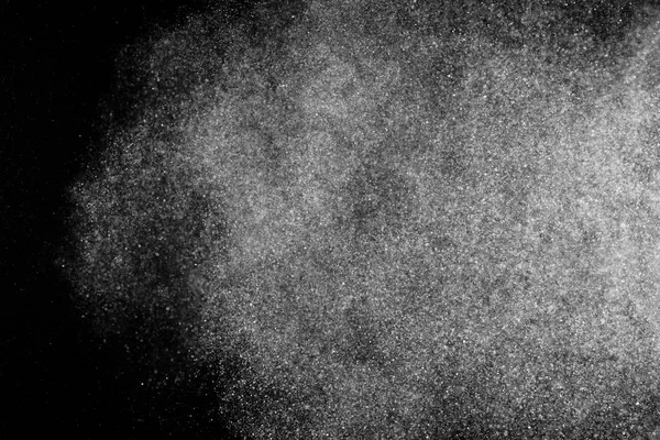 Siyah arka plan üzerine beyaz parçacıkların hareket dondurmak. 