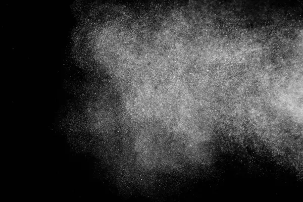 Freeze motion of white particles on black background. — Stock Photo, Image
