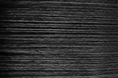 Siyah zemin üzerindeki beyaz parçacıkların hareketlerini dondur. Barut patlaması. Soyut toz tabakası dokusu.