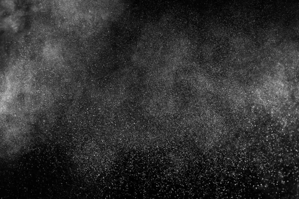 黒い背景に白い粒子の動きを凍結します 火薬爆発だ アブストラクトダストオーバーレイテクスチャ — ストック写真