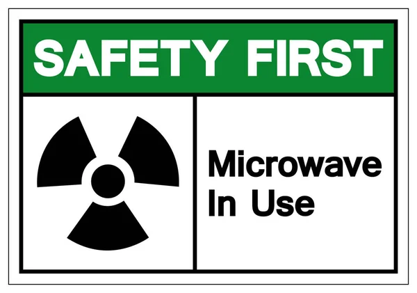 Bezpieczeństwo pierwszy kuchenka mikrofalowa w użyciu symbol znak, wektor ilustracji, wyizolować na białym tle etykiety. Eps10 — Wektor stockowy