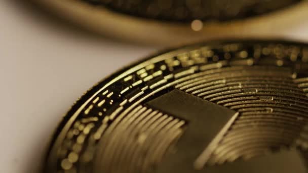 Rotating shot of Bitcoins digital cryptocurrency - BITCOIN MONERO — Stock Video