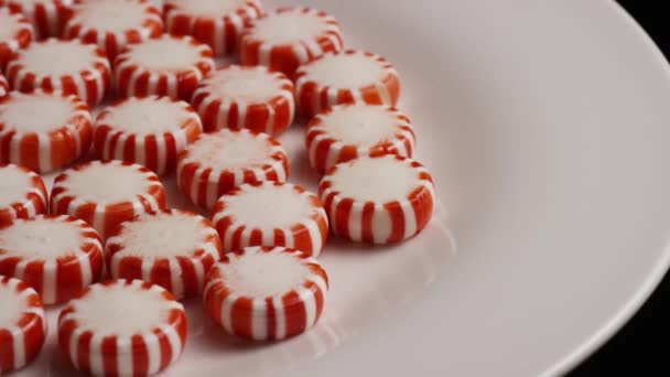 Rotating shot of peppermint candies — Stock Video