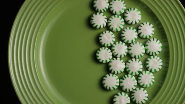 Rotating shot of spearmint hard candies — Stock Video