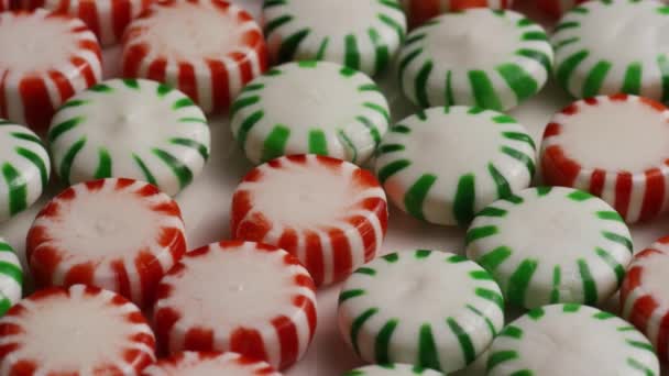 Rotating shot of spearmint hard candies — Stock Video