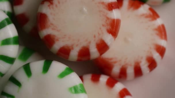 Rotating shot of spearmint hard candies — Stock Video