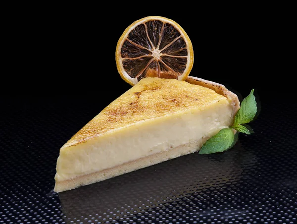 Classic cheesecake on a black background