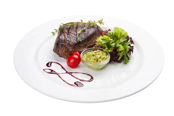 Beef steak with Guacamole sauce. On a white plate — Stock Photo, Image