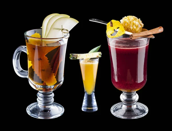 Set of warming drinks on dark background.