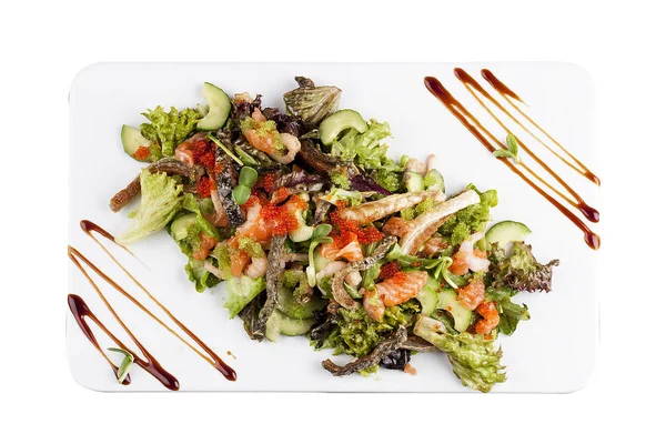 Salad with salmon belly and tobiko caviar on white background — Stock Photo, Image