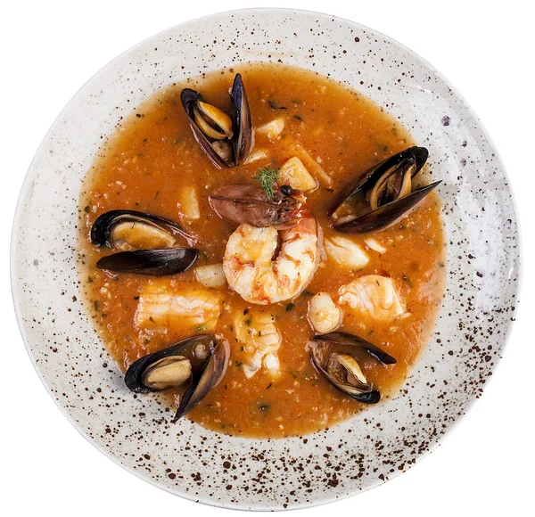 Bouillabaisse. Traditional French fish soup. Top view on white b