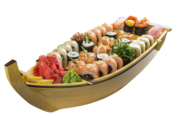 Sushi szett egy fából készült hajón, fehér alapon — Stock Fotó