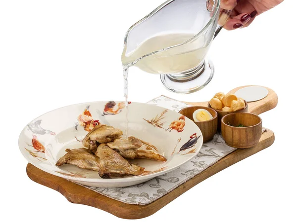 Quail broth with crackers and herbs on a wooden board. On white background. — Stock Photo, Image