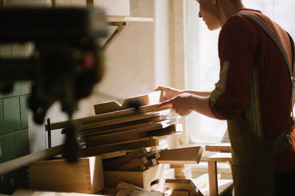 The master works in the carpentry workshop