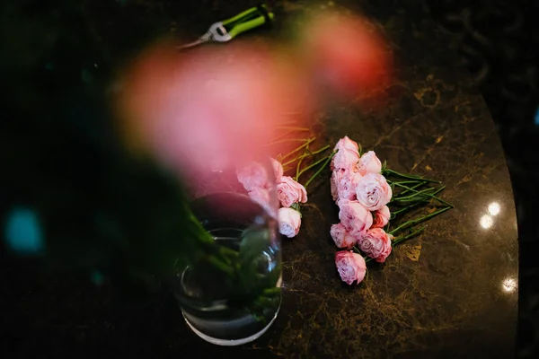 Florist's table with flowers. Florist's workplace. Creating and Making bouquets