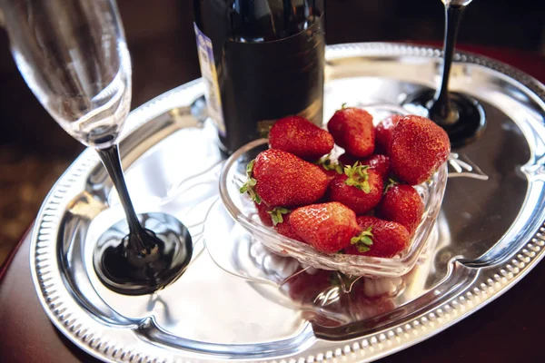 Champagne, glass and strawberry on a tray — Stock Photo, Image