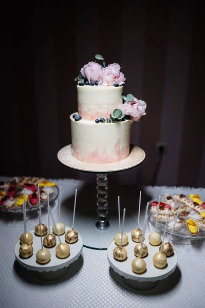 Big wedding cake close-up on the wedding table close up